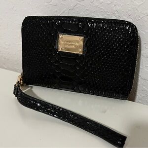 ON SALE $25.    Michael Kors black wristlet. Gold interior. NWOT.